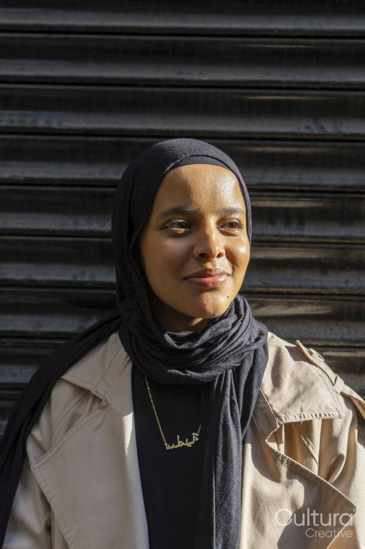 Portrait of young woman wearing hijab