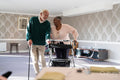 Smiling senior people using mobility walker and cane