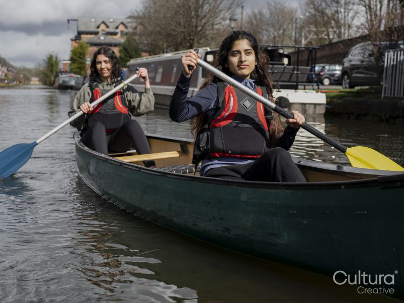 Women canoeing in canal