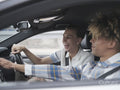 Male couple driving car