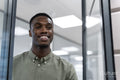 Happy young man in office