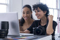 Female photographers using laptop