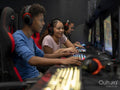 Friends playing video games in gaming club