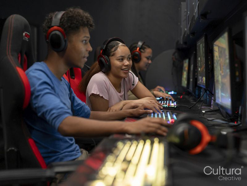 Friends playing video games in gaming club