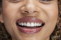 Close-up of smiling woman's lips