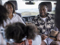 Family with daughter camping in camper van