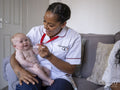 Nurse taking care of baby girl