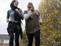 Smiling women jogging together