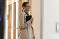 Non binary office worker walking in hallway