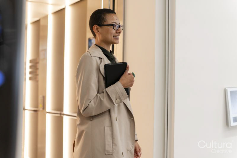 Non binary office worker walking in hallway