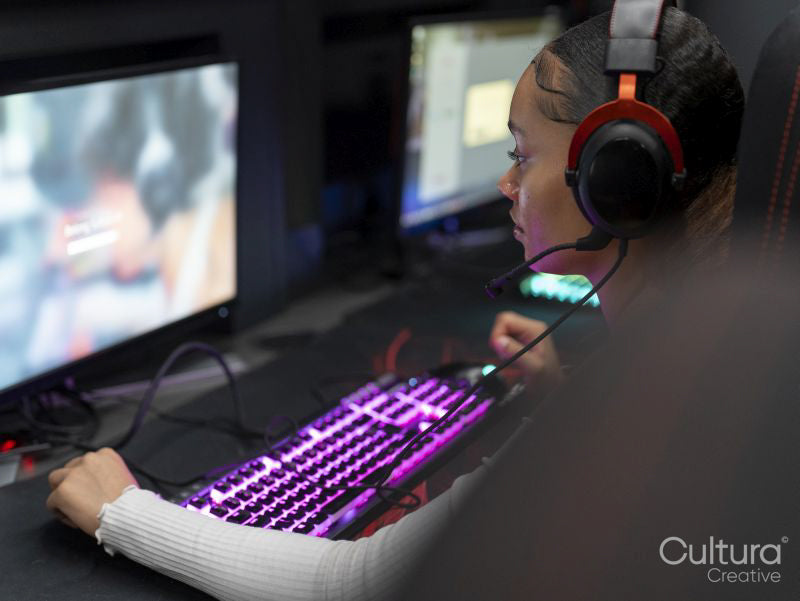 Gamer playing on computer in gaming club