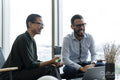 Business people having meeting in office lobby