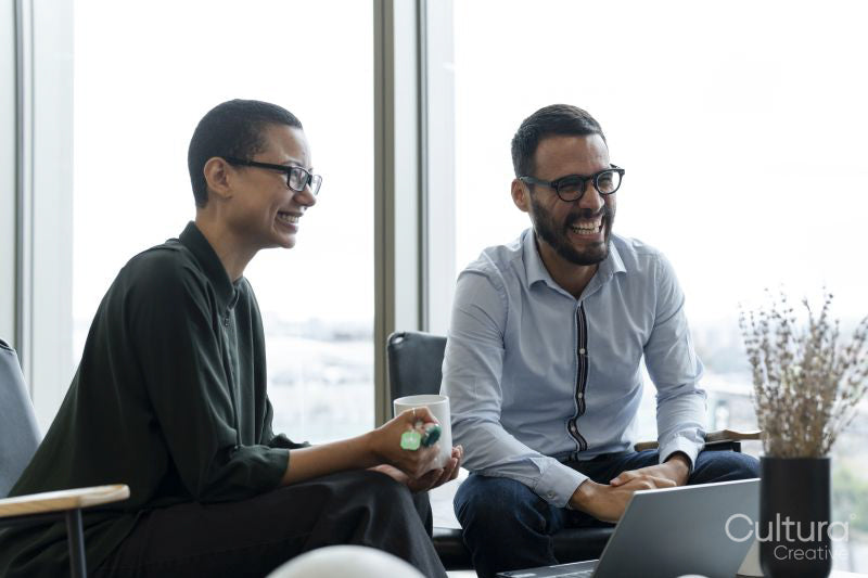 Business people having meeting in office lobby