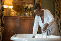 Senior woman making bubble bath