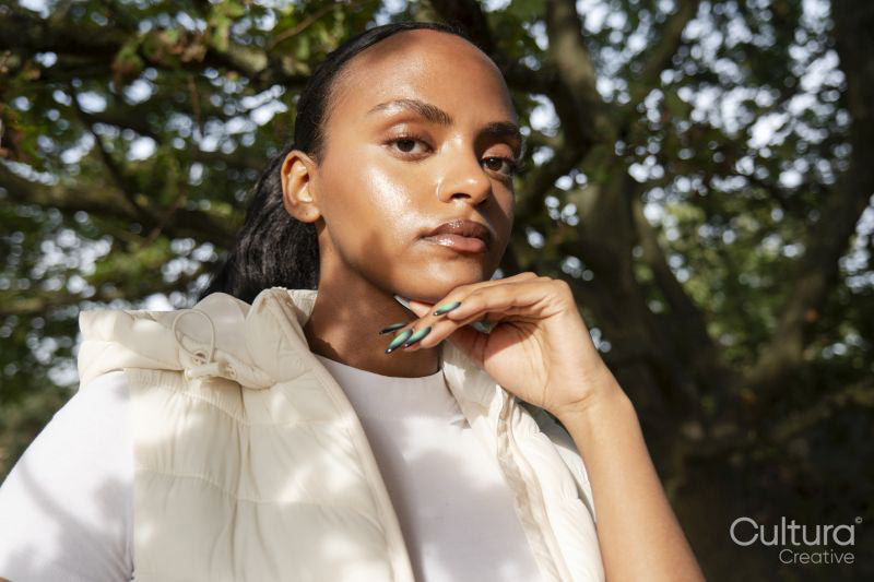 Portrait of woman in sunlight outdoors