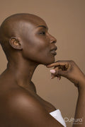 Profile of woman with shaved head