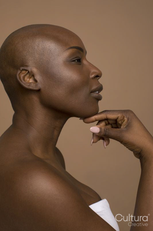 Profile of woman with shaved head