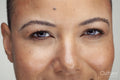 Close-up of smiling woman looking at camera
