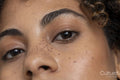 Close up of woman with brown eyes and freckles