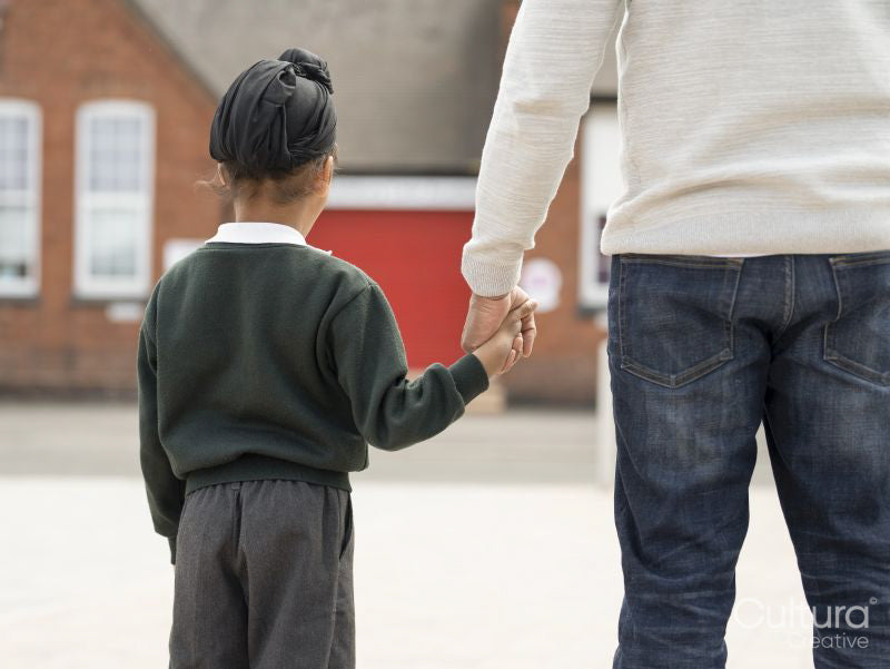Father walking son to school