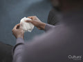 Man holding handkerchief in group therapy session