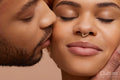 Studio portrait of kissing couple