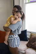 Mother with baby daughter at home