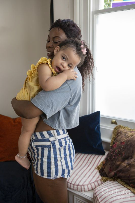 Mother with baby daughter at home