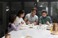 Family dining at home in evening