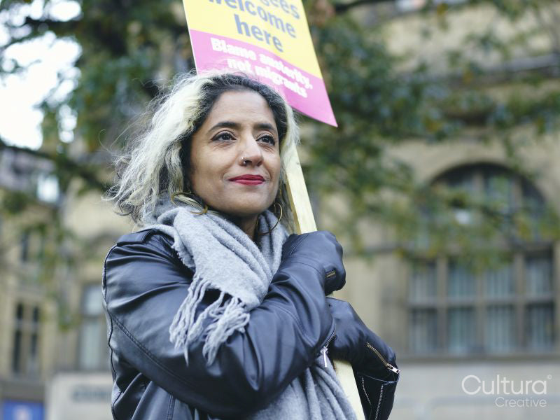 Portrait of woman protesting with placard