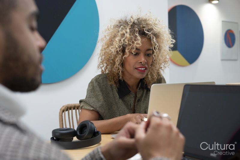 Creative professionals working in office