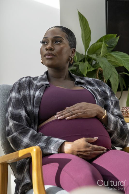 Pregnant woman resting in armchair