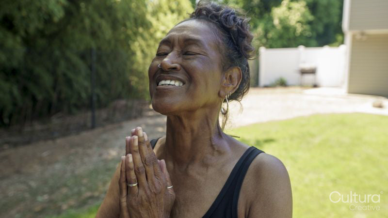 Senior woman doing yoga outdoors