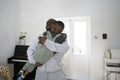 Man with Down syndrome holding boy