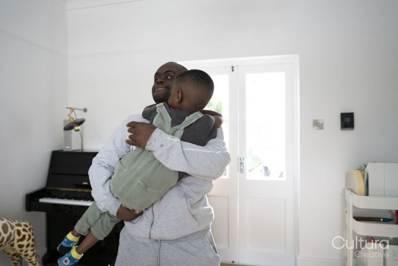 Man with Down syndrome holding boy