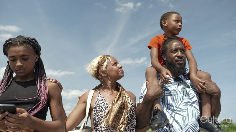 Family walking outdoors on sunny day