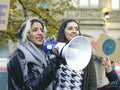Activists holding peace signs protesting in street