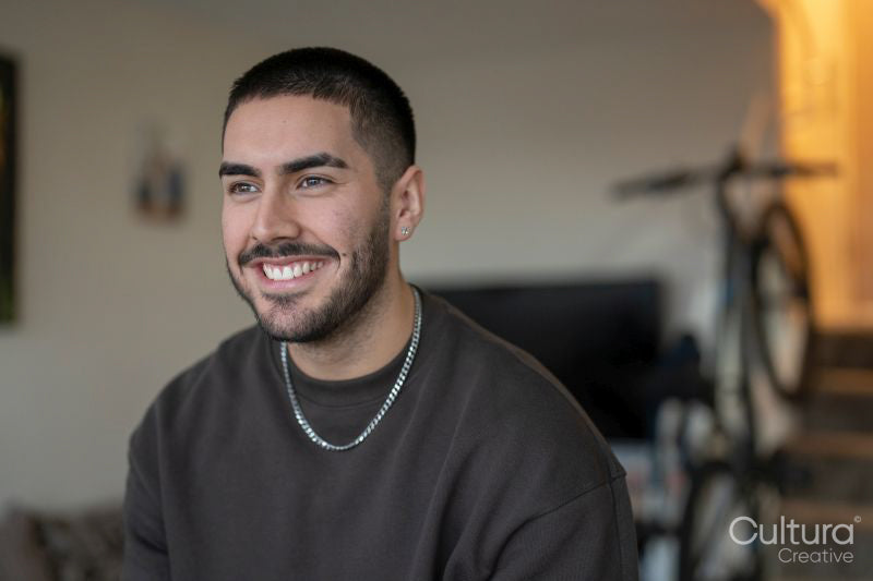 Smiling young man at home
