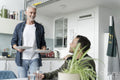 Male couple eating breakfast at home