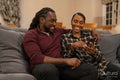 Mid adult couple sitting on sofa