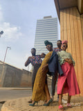 Fashion shot of four people standing in urban street