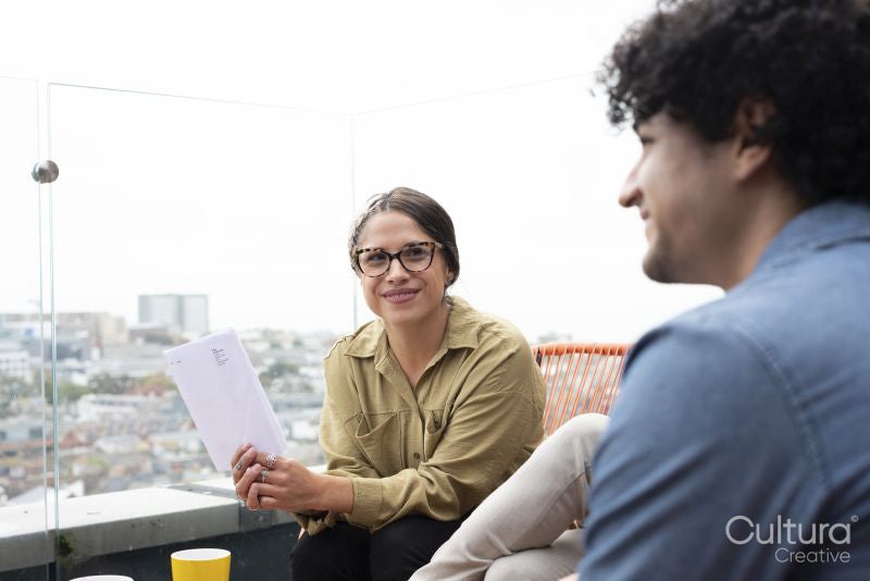 Creative professionals having meeting on office terrace