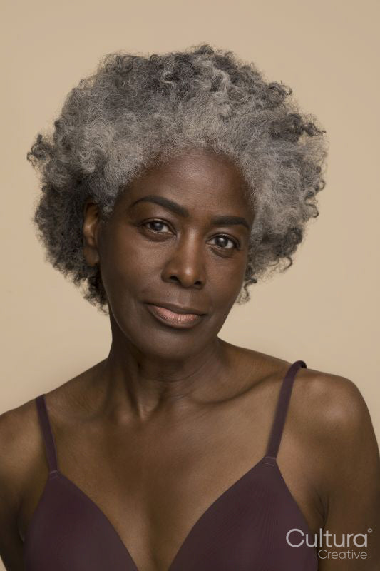 Studio portrait of mature woman