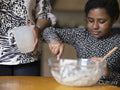 Mother and daughter baking at home