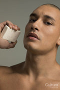 Portrait of man holding soap