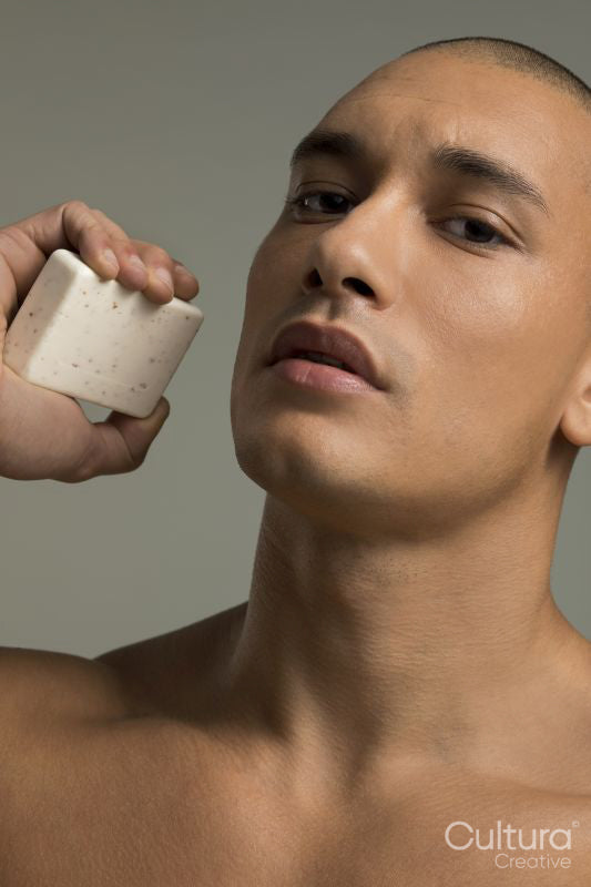 Portrait of man holding soap