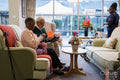 Senior man and woman relaxing on sofa in nursing home