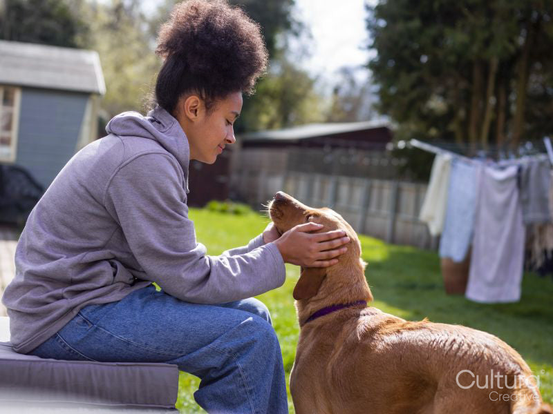 Girl with dog in backyard