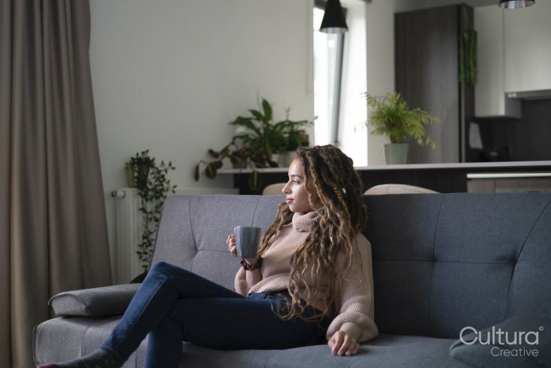 Young woman relaxing in living room