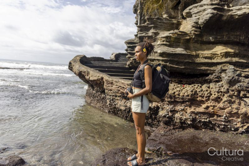 Indonesia, Bali, Female tourist looking at sea view